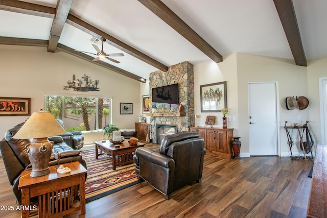 3441 N 162nd Ln, Goodyear, AZ 85395 - living room with dark wood-type flooring, a ceiling fan, a fireplace, and baseboards