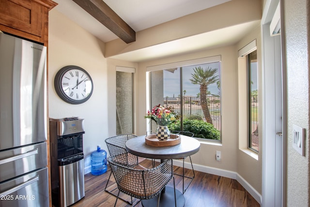 3441 N 162nd Ln, Goodyear, AZ 85395 - dining space with beamed ceiling, wood finished floors, and baseboards