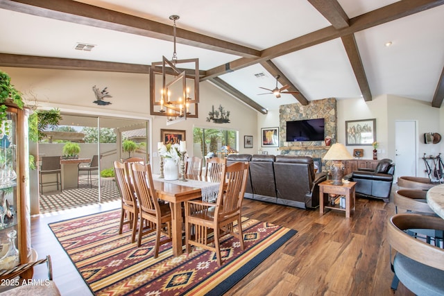 3441 N 162nd Ln, Goodyear, AZ 85395 - dining room with healthy amount of natural light, ceiling fan, dark wood-style flooring, and a chandelier