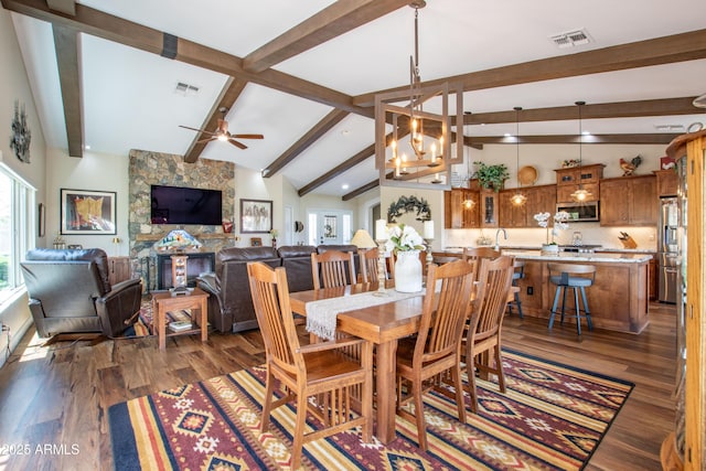 3441 N 162nd Ln, Goodyear, AZ 85395 - dining room with wood finished floors, a ceiling fan, a chandelier, and recessed lighting
