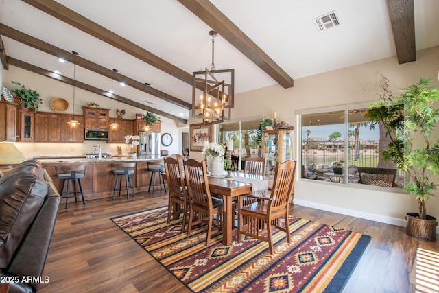 3441 N 162nd Ln, Goodyear, AZ 85395 - dining room with a chandelier, dark wood-type flooring, and recessed lighting