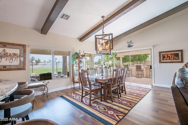 3441 N 162nd Ln, Goodyear, AZ 85395 - dining area featuring a chandelier, baseboards, and wood finished floors