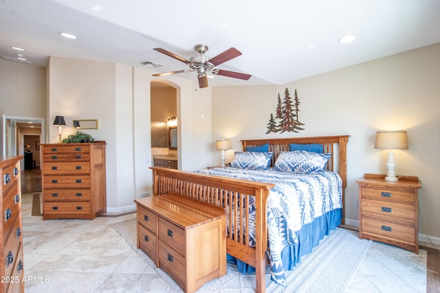 3441 N 162nd Ln, Goodyear, AZ 85395 - bedroom featuring arched walkways, recessed lighting, baseboards, light tile patterned floors, and a ceiling fan