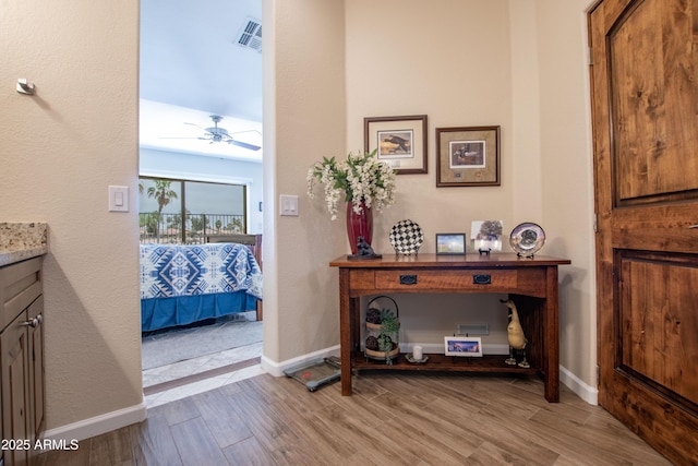 3441 N 162nd Ln, Goodyear, AZ 85395 - hallway featuring light wood finished floors and baseboards