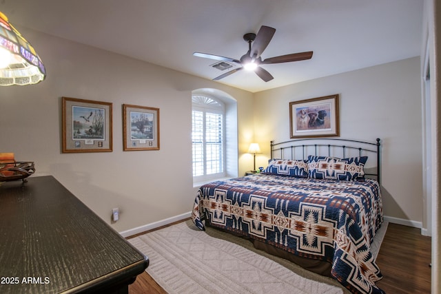 3441 N 162nd Ln, Goodyear, AZ 85395 - bedroom with baseboards, wood finished floors, and ceiling fan