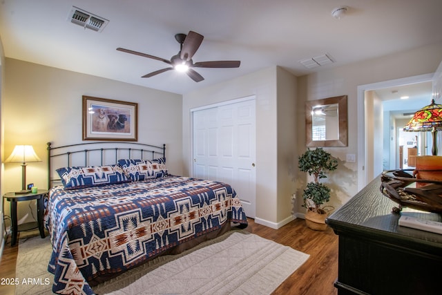 3441 N 162nd Ln, Goodyear, AZ 85395 - bedroom featuring wood finished floors, a closet, baseboards, and ceiling fan