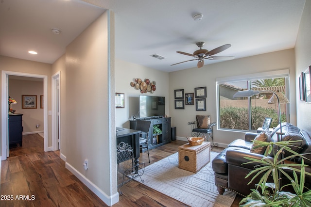 3441 N 162nd Ln, Goodyear, AZ 85395 - living area featuring wood finished floors, ceiling fan, baseboards, and recessed lighting