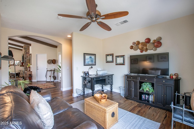 3441 N 162nd Ln, Goodyear, AZ 85395 - living room with arched walkways, a ceiling fan, wood finished floors, and baseboards