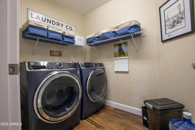 3441 N 162nd Ln, Goodyear, AZ 85395 - laundry area featuring washer and clothes dryer, wood finished floors, and baseboards