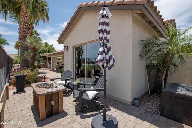 3441 N 162nd Ln, Goodyear, AZ 85395 - view of patio / terrace with an outdoor fire pit