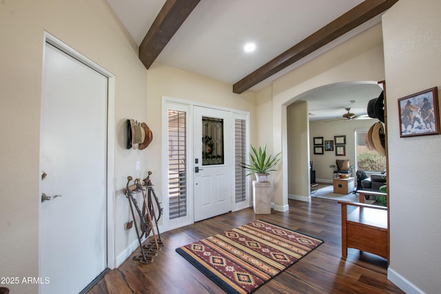3441 N 162nd Ln, Goodyear, AZ 85395 - entrance foyer with beamed ceiling, ceiling fan, arched walkways, wood finished floors, and baseboards