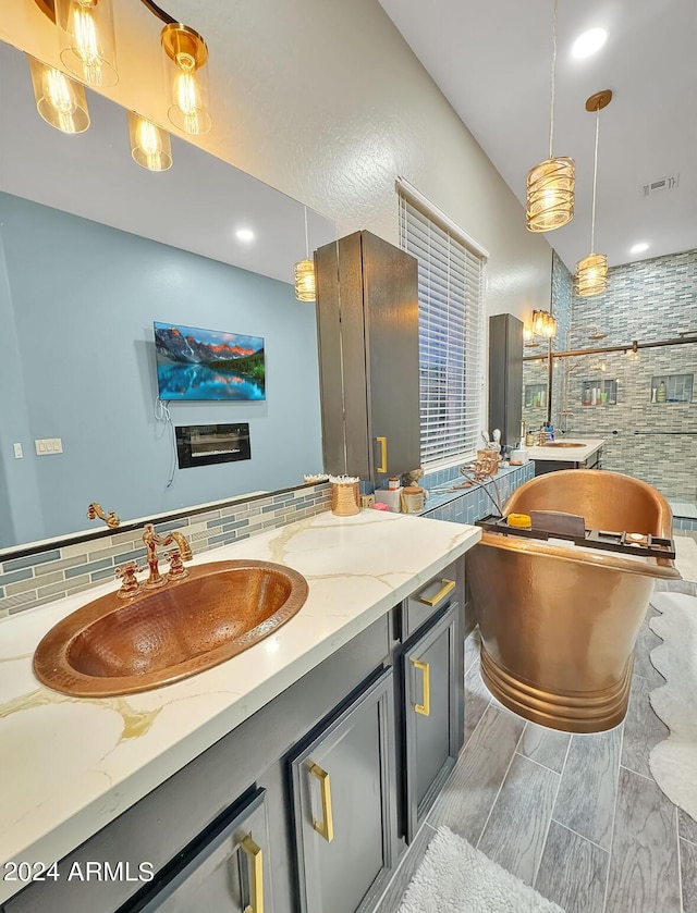 bathroom featuring decorative backsplash and vanity