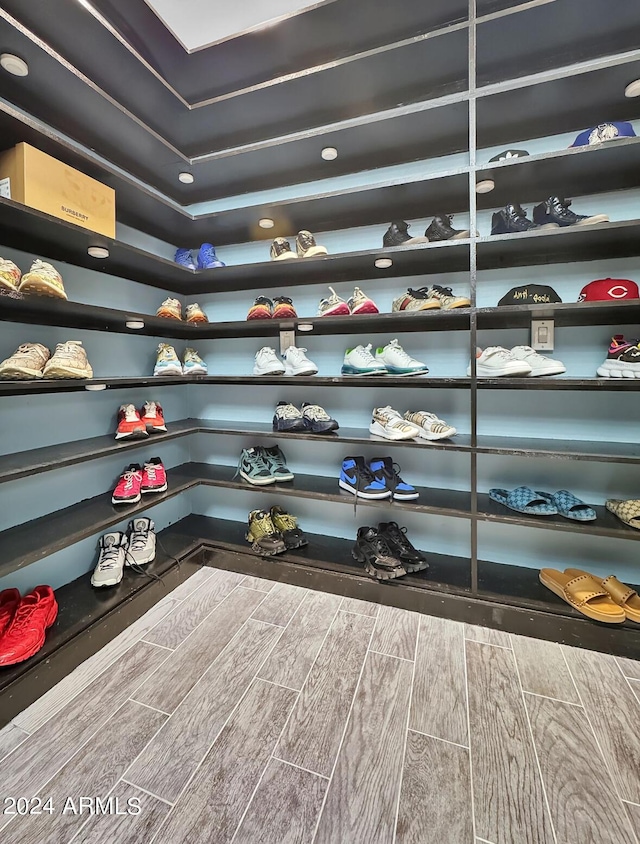 spacious closet featuring hardwood / wood-style floors