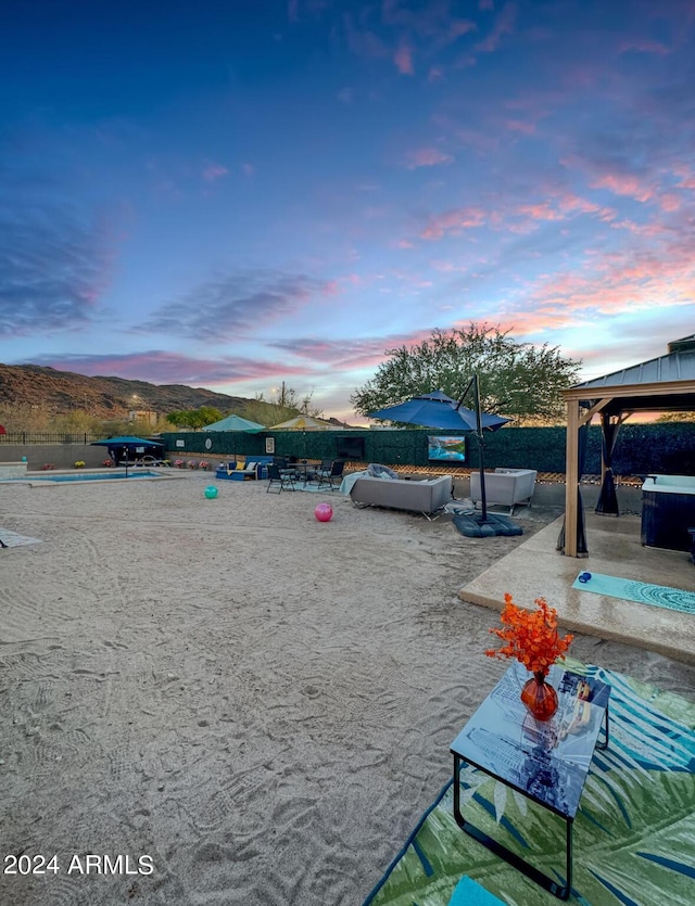 exterior space featuring a gazebo and a mountain view