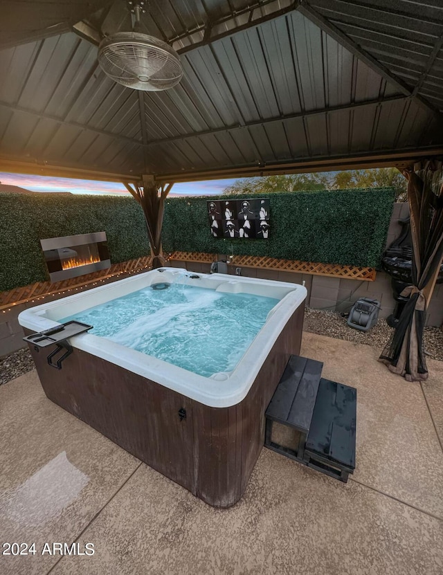 view of swimming pool with a patio area and a hot tub