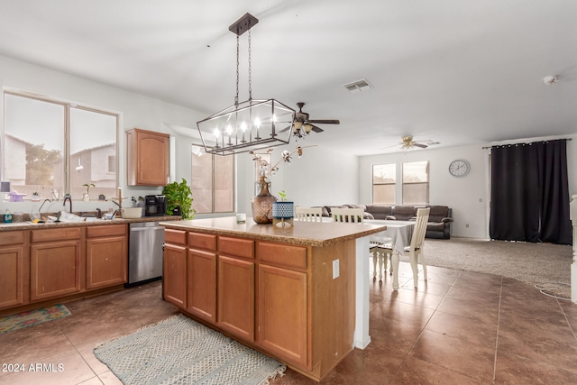 kitchen with a center island, pendant lighting, sink, dishwasher, and ceiling fan with notable chandelier