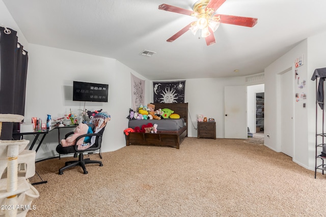 interior space with ceiling fan and carpet