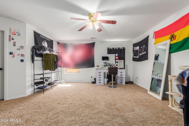 interior space with ceiling fan and carpet floors