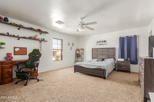 carpeted bedroom featuring ceiling fan