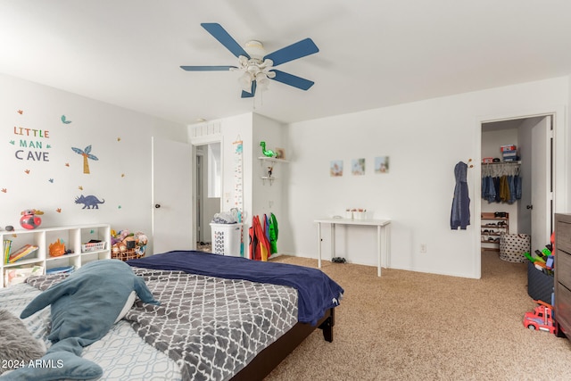 bedroom featuring ceiling fan, a closet, and carpet