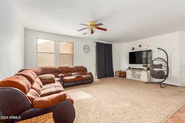 carpeted living room featuring ceiling fan