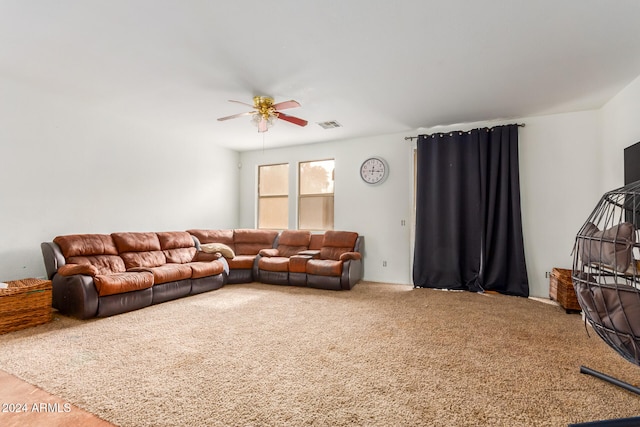 carpeted living room featuring ceiling fan