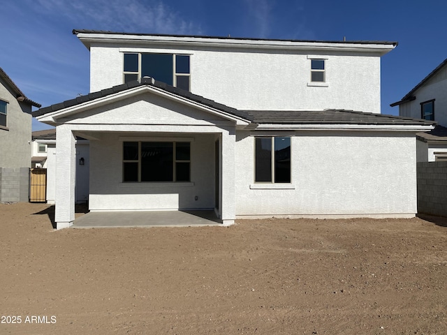 back of property featuring a patio area