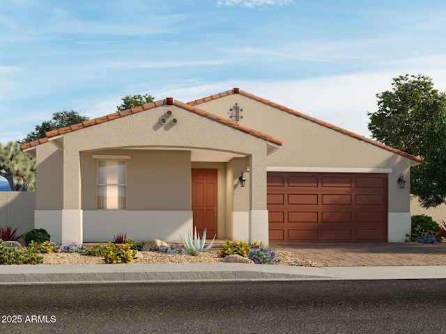 17567 W Pierson St, Goodyear, AZ 85395 - mediterranean / spanish house with driveway, stucco siding, a garage, and a tiled roof