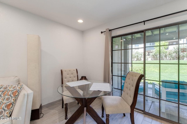 dining area with light hardwood / wood-style floors