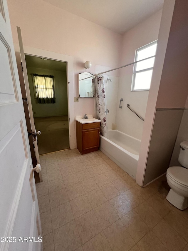 full bathroom with toilet, shower / tub combo, and vanity