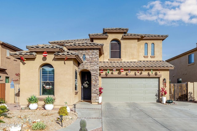 mediterranean / spanish-style house featuring a garage