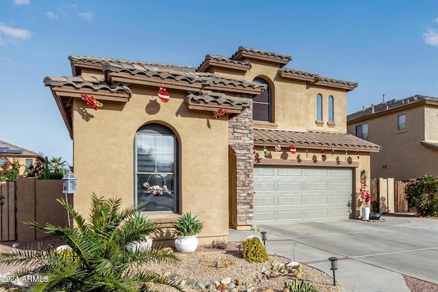 mediterranean / spanish-style home with a garage