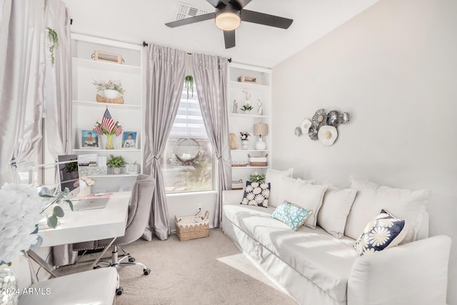 carpeted office featuring ceiling fan