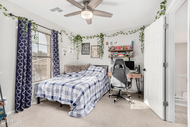 carpeted bedroom featuring ceiling fan