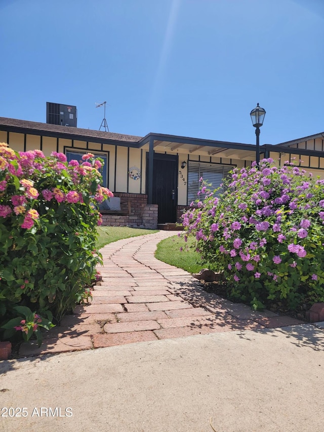 view of front of house with central AC unit