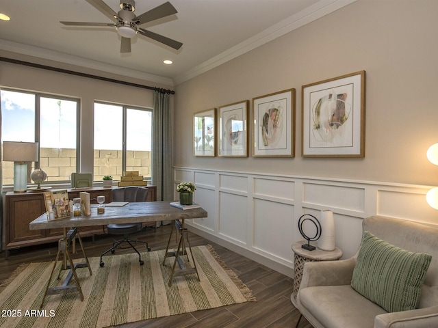 office featuring a decorative wall, dark wood-style flooring, crown molding, and wainscoting