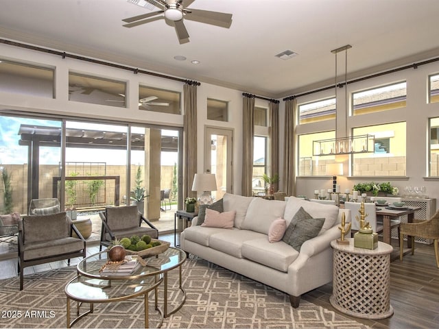 sunroom / solarium with visible vents and a ceiling fan