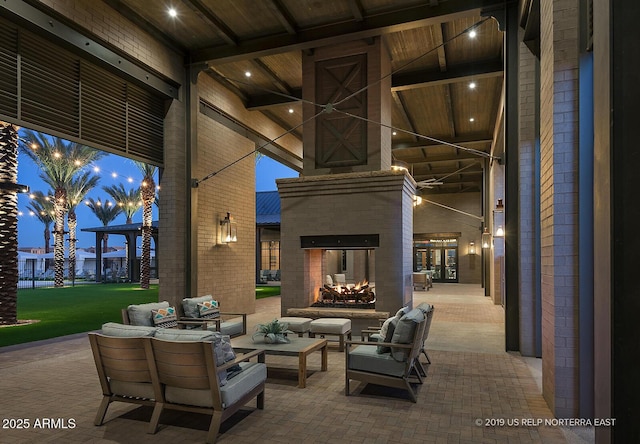 view of patio / terrace featuring an outdoor living space with a fireplace