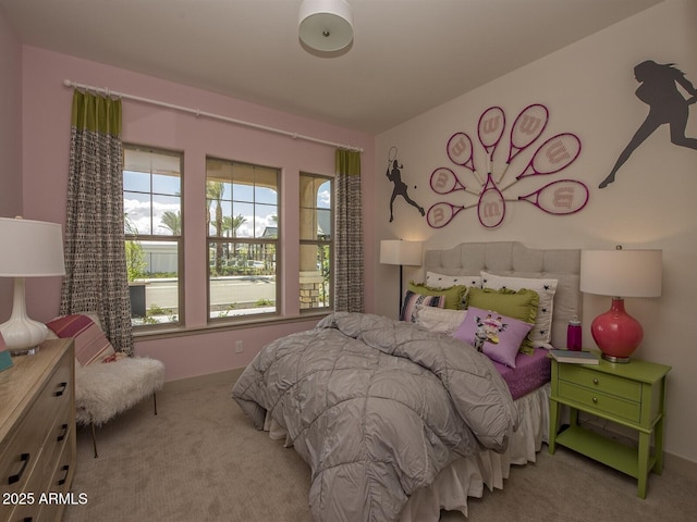 bedroom featuring light colored carpet