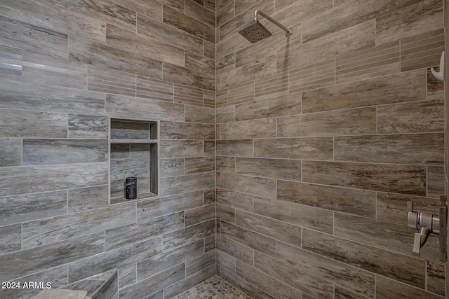 bathroom featuring tiled shower