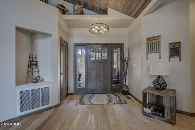 4047 W Forest Ct, Pine, AZ 85544 - foyer entrance with vaulted ceiling, baseboards, a chandelier, visible vents, and wood finished floors