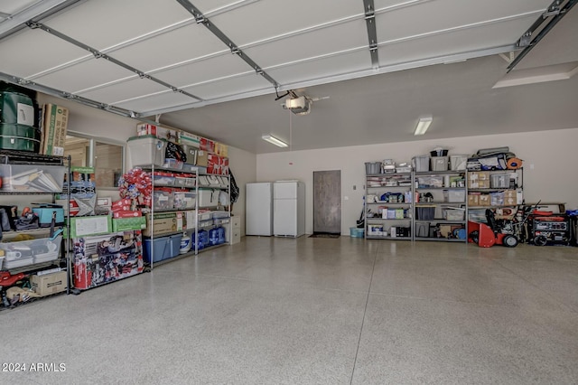 4047 W Forest Ct, Pine, AZ 85544 - garage with freestanding refrigerator and a garage door opener
