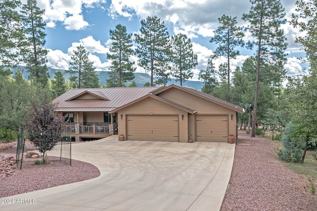 ranch-style house featuring a mountain view and a garage