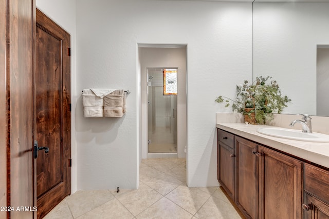 3105 S Amble Pass, Gold Canyon, AZ 85118 - bathroom featuring tile floors, a shower with door, and vanity