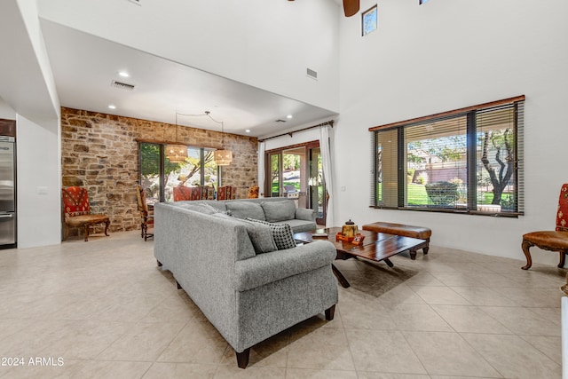 3105 S Amble Pass, Gold Canyon, AZ 85118 - tiled living room with brick wall
