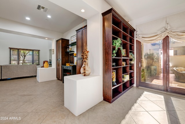 corridor featuring light tile flooring