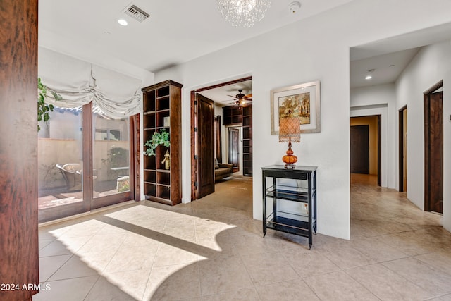 3105 S Amble Pass, Gold Canyon, AZ 85118 - interior space with light tile flooring and a chandelier