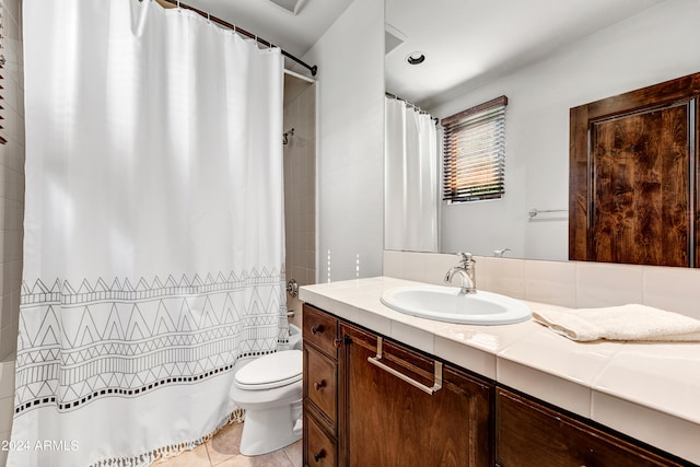 3105 S Amble Pass, Gold Canyon, AZ 85118 - bathroom with toilet, vanity, tile walls, backsplash, and tile floors