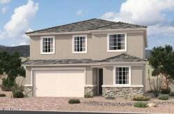 traditional-style house with a garage and decorative driveway