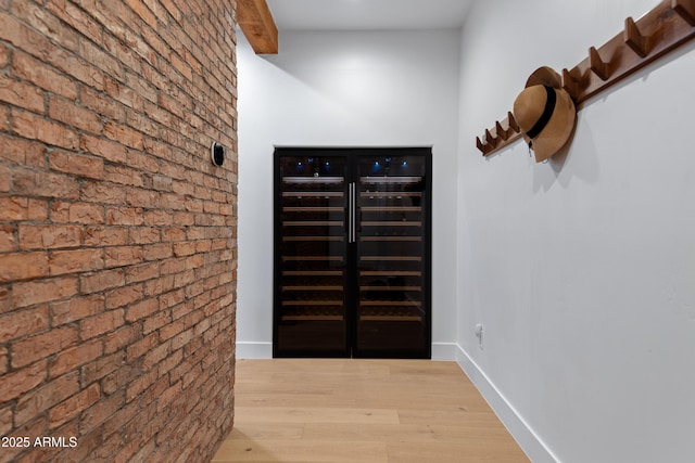 6648 E Horseshoe Rd, Paradise Valley, AZ 85253 - interior space with baseboards, brick wall, and wood finished floors